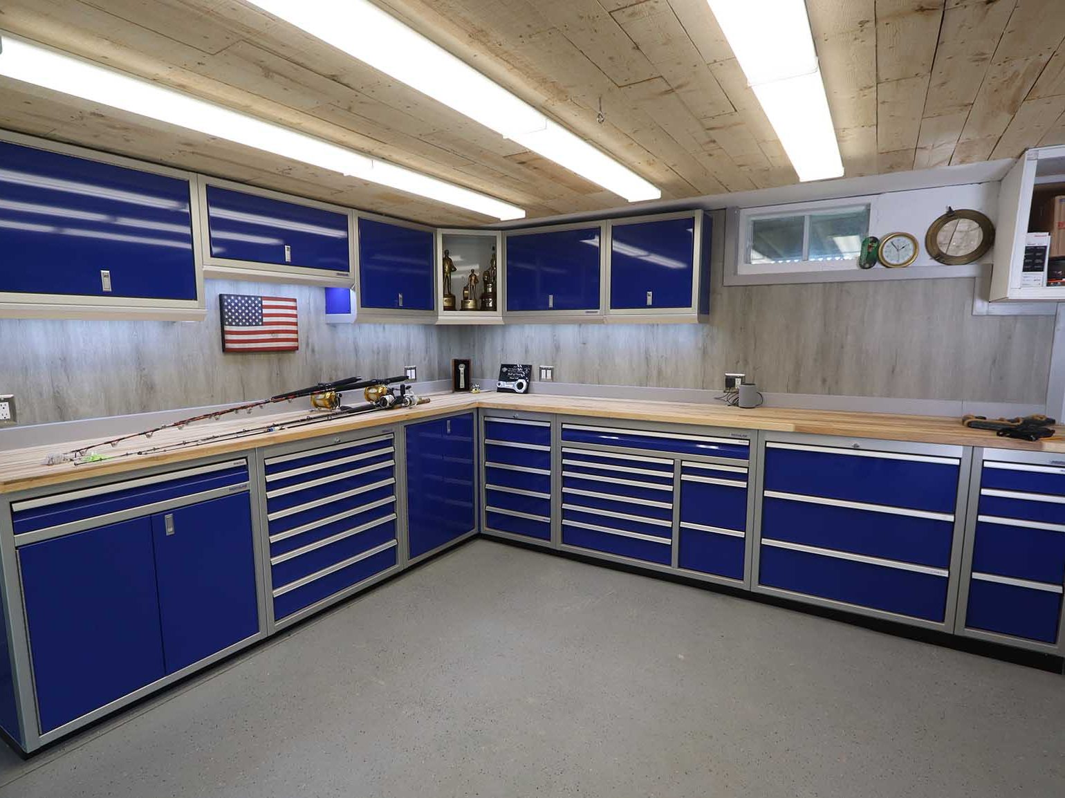 Sleek garage interior featuring premium custom aluminum cabinets for storage.