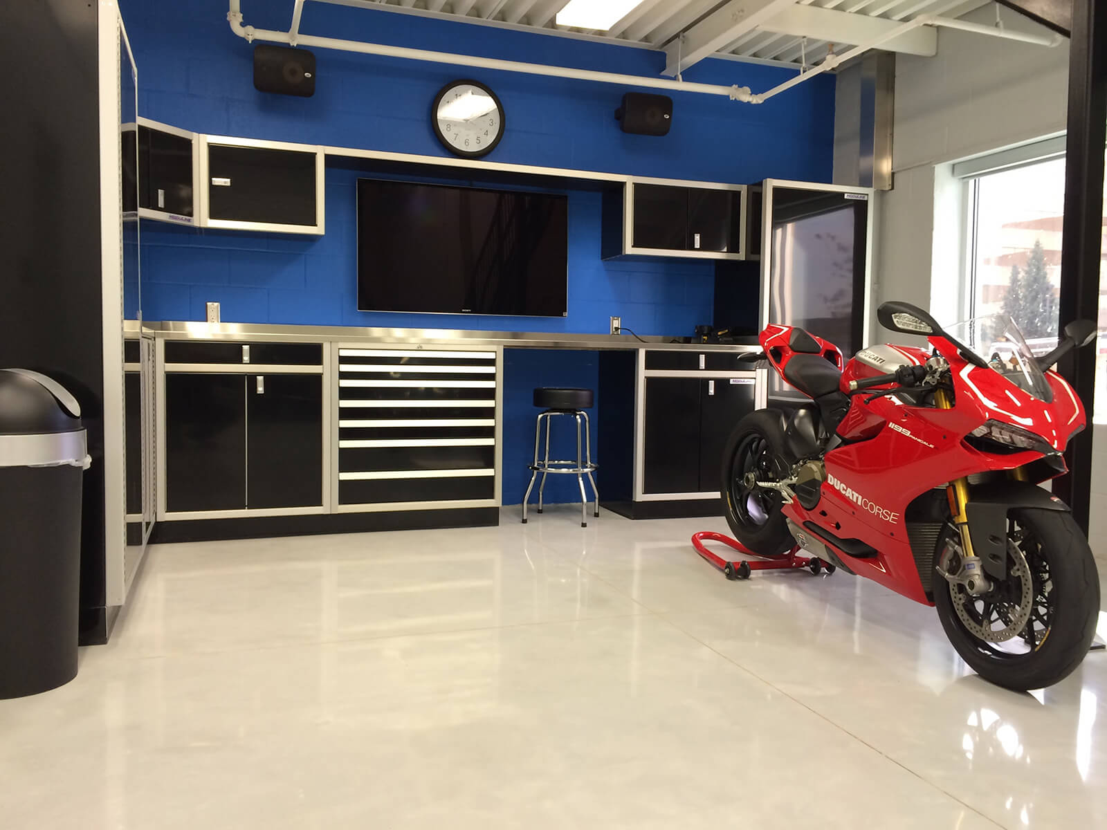 Close-up of heavy-duty custom aluminum cabinets and garage workbench.