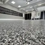 Seamless custom flake pattern polyaspartic floor coating showroom finish