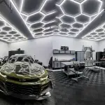Modern garage workshop interior with bright Hexagon LED lighting setup on the ceiling.