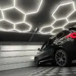 lose-up of premium Hexagon LED light panels installed on a garage ceiling.