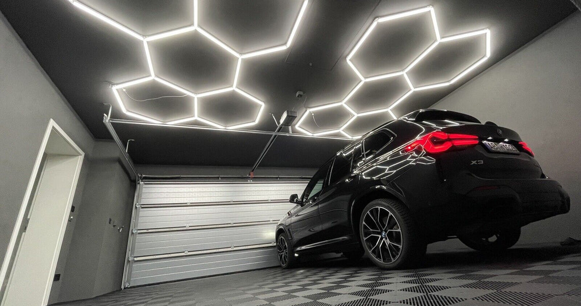 lose-up of premium Hexagon LED light panels installed on a garage ceiling.