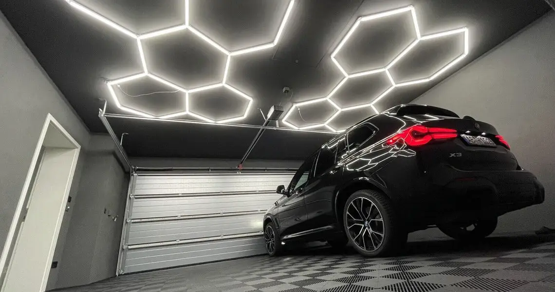 lose-up of premium Hexagon LED light panels installed on a garage ceiling.
